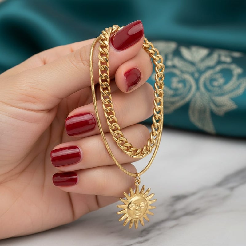 An elegant gold bracelet made of rust-resistant stainless steel, with a double design combining a wide chain and a smooth chain with an attractive sun pendant, with an adjustable clasp to suit you. - Image 5